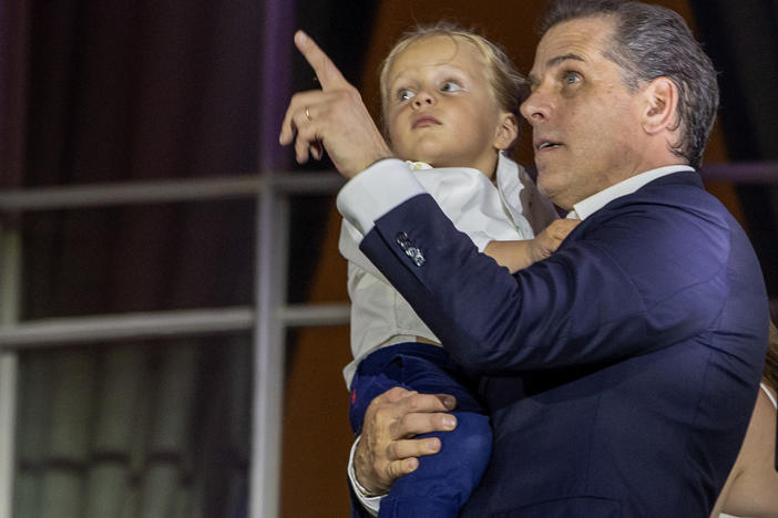 Hunter Biden, holding Beau Biden, watches fireworks on the South Lawn of the White House on July 04, 2023 in Washington, D.C.