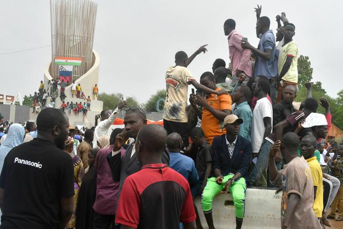 Supporters of the Nigerien defence and security forces gather during a demonstration outside the national assembly in Niamey on July 27, 2023.