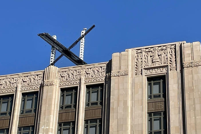 The new X sign is installed Friday on the roof of the San Francisco headquarters of Twitter, which is being rebranded as "X." Elon Musk killed off the Twitter logo on Monday, replacing the world-recognized blue bird with an X as the tycoon accelerates his efforts to transform the floundering social media giant.