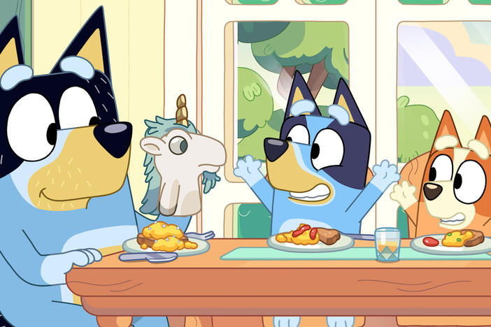 Bandit (left) with his daughters Bluey (center) and Bingo (right).