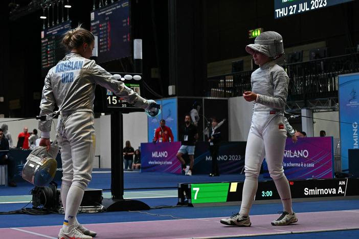 Ukraine's Olha Kharlan (L) refuses to shake hands with Russia's Anna Smirnova, registered as an Individual Neutral Athlete (AIN), after she defeated her during the Sabre Women's Senior Individual qualifiers, as part of the FIE Fencing World Championships on July 27.