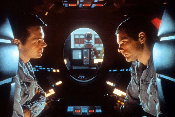 Malevolent robot stories used to be more about brawn than brain — so it was a genuine shock for audiences in 1968 when the sentient HAL-9000 computer calmly said, "I'm sorry, Dave, I'm afraid I can't do that." Above, Gary Lockwood and Keir Dullea in <em>2001: A Space Odyssey</em>.