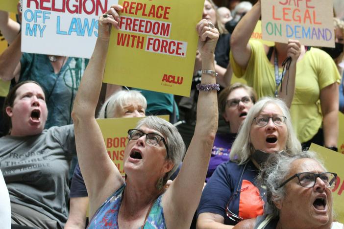 Protestors rallied at the Statehouse in Indianapolis on July 25, 2022, in opposition to a bill to ban abortions in Indiana. After a protracted legal fight lasting almost a year, the state's highest court ruled the ban could go into effect as soon as Aug. 1.