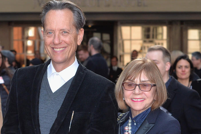 Richard E. Grant says he continues to have an "ongoing silent conversation" with his wife Joan Washington, who died in 2021. They are shown above attending an awards show in London in 2016.