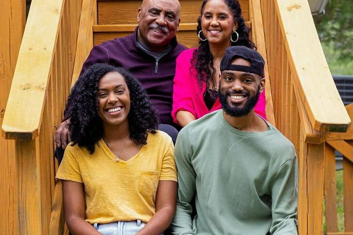 Jeremy Nottingham (bottom right) sits for a family photo with his parents, Junius and Sharon, and sister Briana.