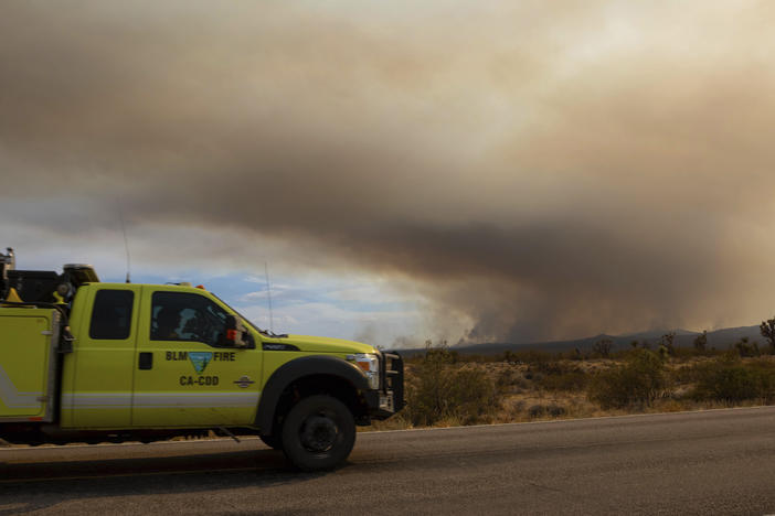 A fire truck heads toward the York Fire on July 30 in the Mojave National Preserve, Calif.