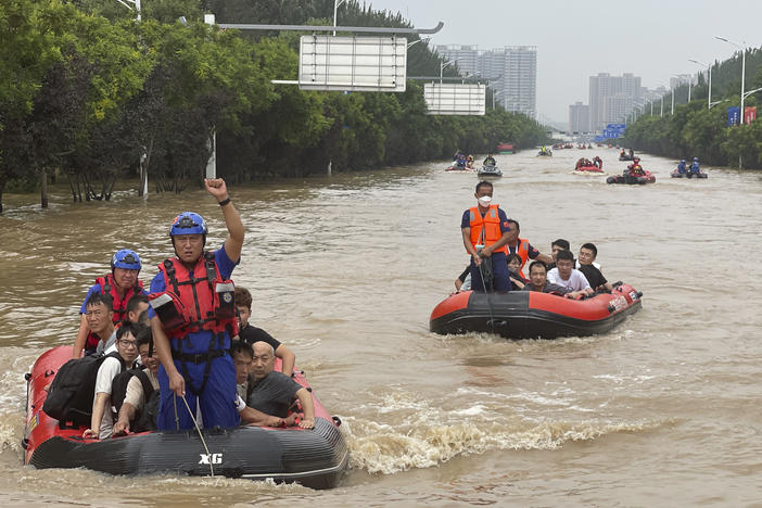 Residents are evacuated by rubber boats through flood waters in Zhuozhou in northern China's Hebei province, south of Beijing, Wednesday. China's capital has recorded its heaviest rainfall in at least 140 years over the past few days. Among the hardest hit areas is Zhuozhou, a small city that borders Beijing's southwest.