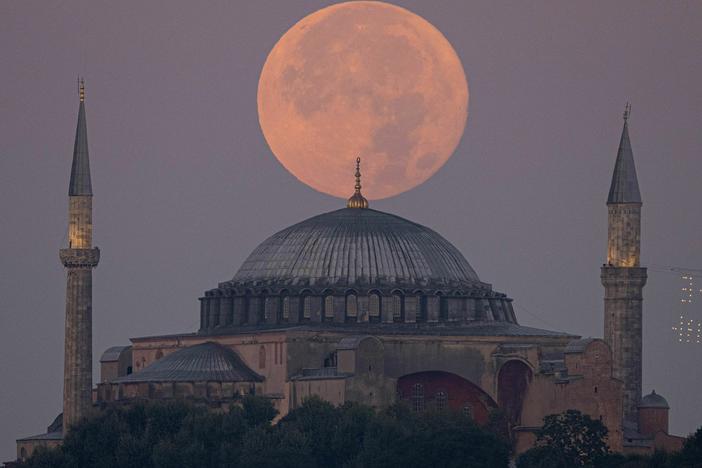 The sturgeon supermoon rises over the Hagia Sophia Grand Mosque in Istanbul on Wednesday.