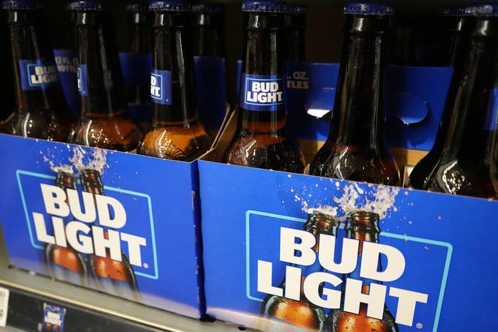 Bud Light's parent company, Anheuser-Busch, says sales and profits dropped in the U.S. between April and June.