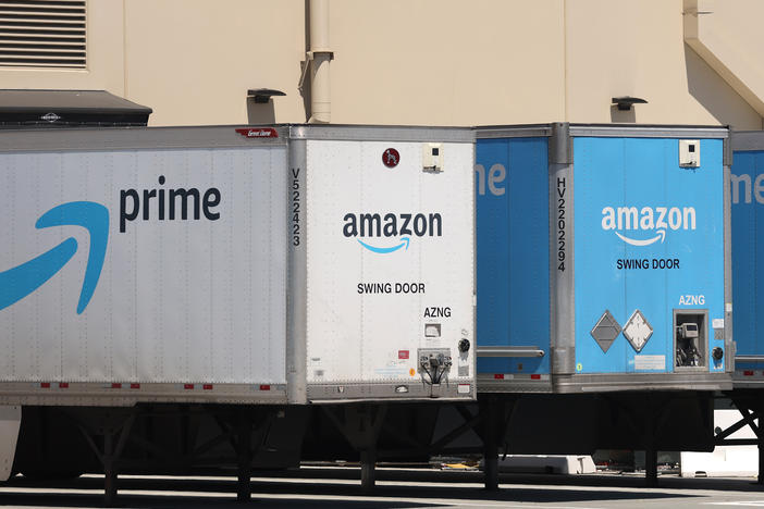 Amazon delivery trucks are parked in Richmond, Calif., on June 21.