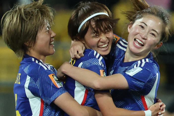 Japanese midfielder Hinata Miyazawa, center, celebrates after scoring her team's third goal during its match against Spain earlier this week. Japan is one of three teams to win all its games in the group stage.