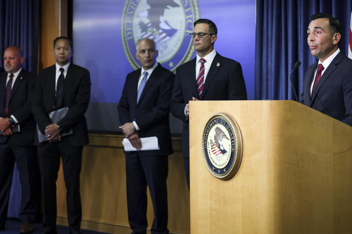 U.S. Attorney Martin Estrada for the Central District of California, right, speaks during a press conference at the U.S. Attorney's Office for the Southern District of California on Thursday, Aug. 3, 2023, in San Diego.