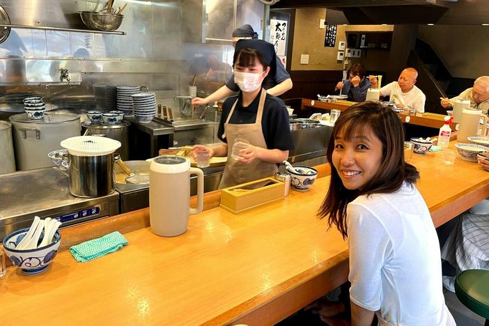 The author awaits a bowl of ramen noodles in a Tokyo restaurant.