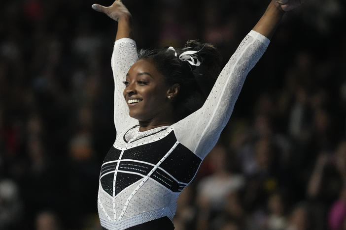 Simone Biles reacts after performing in the floor exercise at the U.S. Classic gymnastics competition Saturday, Aug. 5, 2023, in Hoffman Estates, Ill.