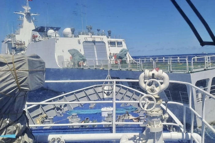 In this photo provided by the Philippine Coast Guard, a Chinese Coastguard ship, front, allegedly blocks the path of a Philippine Coast Guard ship near the Philippine-occupied Second Thomas Shoal, South China Sea during a re-supply mission on Saturday Aug. 5, 2023.