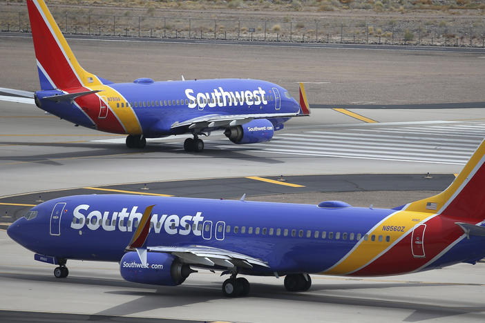 Southwest Airlines planes taxi at Phoenix Sky Harbor International Airport in July 2019. Southwest is facing a discrimination suit after an employee allegedly reported a passenger to police on suspicion of child trafficking.