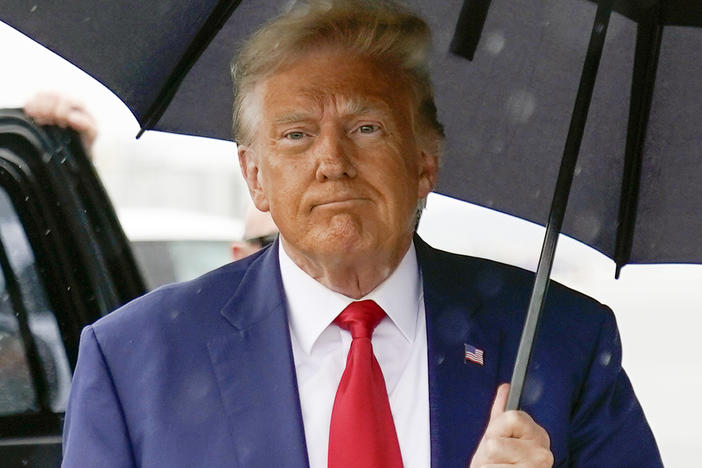 Former President Donald Trump walks to speak with reporters before boarding his plane at Ronald Reagan Washington National Airport on Aug. 3 in Arlington, Va.