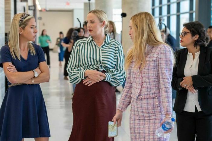 Plaintiffs Amanda Zurawski (far left), Austin Dennard, Taylor Edwards, and Elizabeth Weller speak together at the Travis County Courthouse on July 20, 2023 in Austin, Texas.