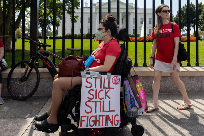 Protesters march outside the White House to call attention to those who have long COVID and those who have the disabling disease Myalgic encephalomyelitis/chronic fatigue syndrome (ME/CFS).