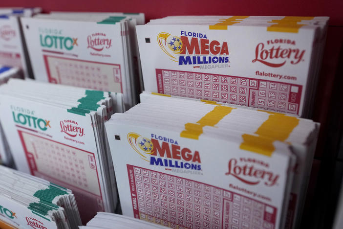 Lottery forms are shown, Monday, Aug. 7, 2023, at the Presidente Supermarket in the Little Havana neighborhood of Miami. Mega Millions jackpot has grown to $1.55 billion, making it the third-largest ever ahead of Tuesday night's drawing.
