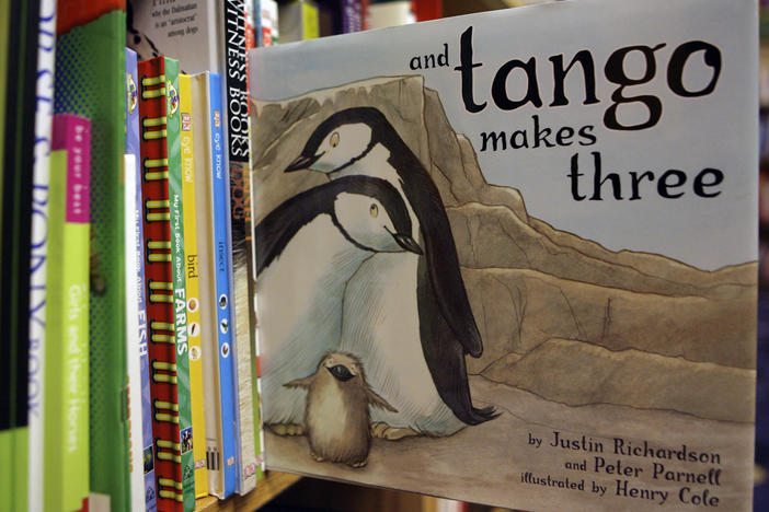 A copy of the book "And Tango Makes Three" is photographed on a bookstore shelf in Chicago in 2006. Months after access to the popular children's book about a male penguin couple hatching a chick was restricted at school libraries, a central Florida school district says it has reversed that decision.