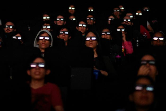 Filmgoers watch a screening of Marvel Studios' <em>Avengers: Endgame</em> at a cinema in Caracas in April 2019. More than 50 workers at Marvel Studios in LA, New York and Atlanta have signed authorization cards to be represented by the International Alliance of Theatrical Stage Employees, or IATSE.