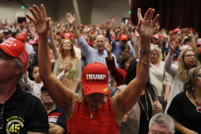 People pray during a "Evangelicals for Trump" campaign event in 2020.