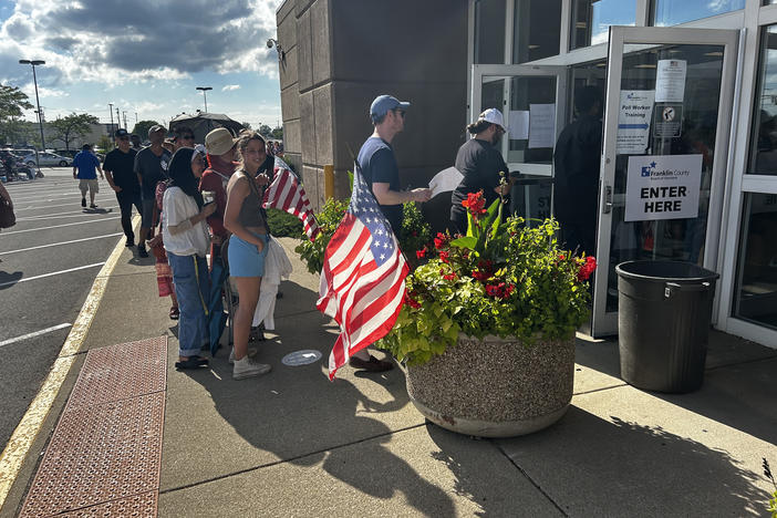 Voters wait to cast their ballots on Ohio's controversial Issue 1. Long lines have been reported at early voting centers in some counties.
