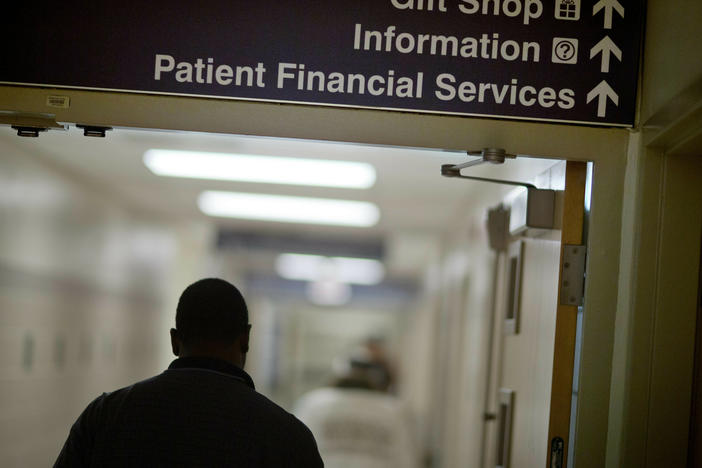 A sign points visitors toward the financial services department at Grady Memorial Hospital, in Atlanta.