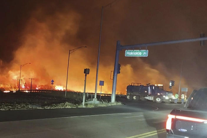 This photo provided by County of Maui shows fire and smoke filling the sky from wildfires near the Lahaina Bypass in Maui, Hawaii, on Tuesday.