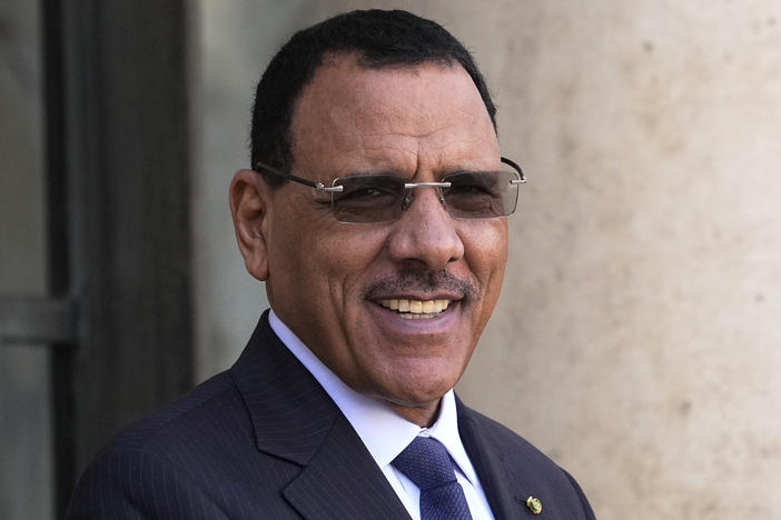 Niger's President Mohamed Bazoum smiles before a working lunch with French President Emmanuel Macron, Feb. 16, 2023 at the Elysee Palace in Paris.