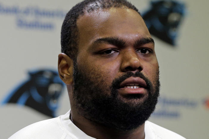 Carolina Panthers' Michael Oher speaks to the media during their NFL football offseason conditioning program in Charlotte, N.C., on April 20, 2015. Oher, the former NFL tackle known for the movie <em>The Blind Side</em>, filed a petition Monday accusing Sean and Leigh Anne Tuohy of lying to him by having him sign papers making them his conservators, not his adoptive parents, in 2004.