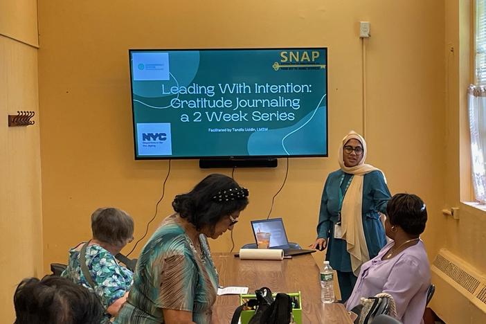 Social worker Tanzila Uddin leads a workshop on journaling at a senior center in Queens Village in NYC. These gatherings can identify older adults who may need more mental health treatment.