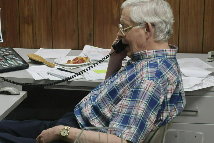 Eric Meyer, publisher of the Marion County (Kansas) Record, shown speaking with a British radio station about the raid on his newspaper's offices and his home by local police.