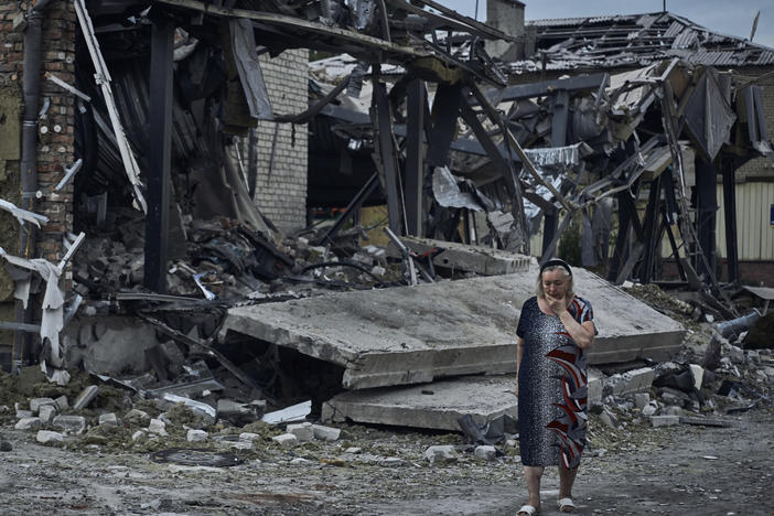 A woman at the scene of a building damaged after Russian missile strikes in Pokrovsk, Donetsk region, Ukraine, Aug. 9.