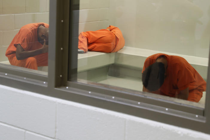 Immigrants await processing at an Immigration and Customs Enforcement (ICE) detention center in Adelanto, California. By filing a lawsuit under the Freedom of Information Act, NPR obtained a trove of inspection reports detailing serious problems at this ICE facility and others across the United States.