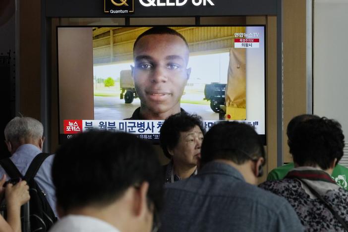 A TV screen shows a file image of U.S. soldier Travis King during a news program at the Seoul Railway Station in Seoul, South Korea, Wednesday, Aug. 16, 2023.