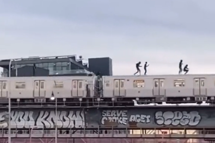 A screenshot from a video uploaded to TikTok by @big.ebk, which has since been removed, shows subway surfers in New York City. Four teens have died performing the dangerous stunt in the city this year.