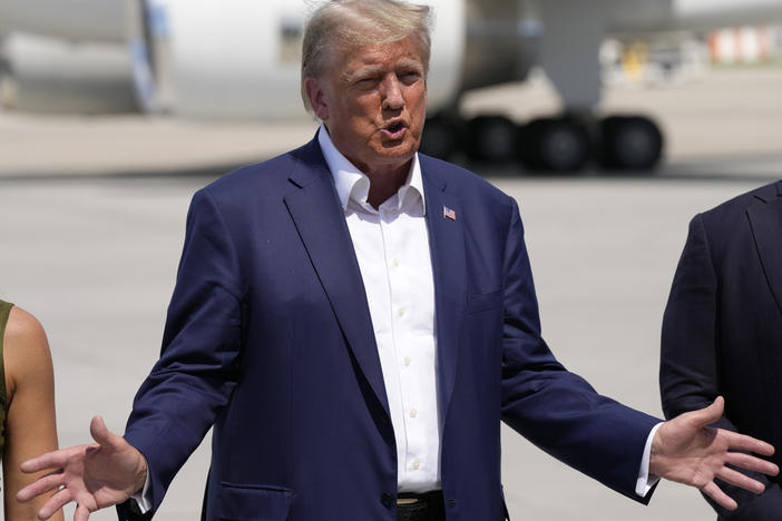 Republican presidential candidate former President Donald Trump speaks to reporters at the Des Moines International Airport after a visit to the Iowa State Fair on Saturday in Des Moines, Iowa.