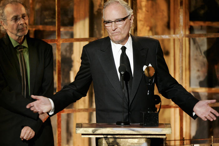 Jerry Moss, right, and Herb Alpert, co-founders of A&M Records, appear during their induction into the Rock & Roll Hall of Fame in New York on March 13, 2006. Moss, a music industry giant who co-founded A&M Records, died Wednesday at his home in Bel Air, Calif. He was 88.