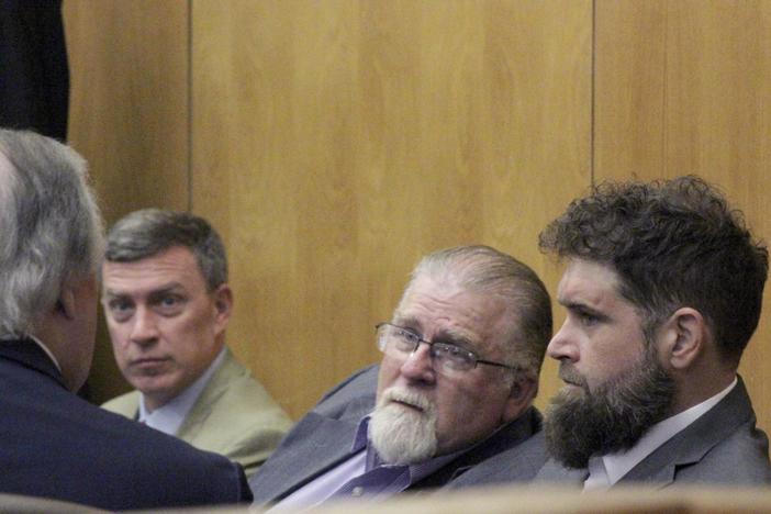 Gregory Case, the father, center, and Brandon Case, the son, right, speak with an attorney, Wednesday, Aug. 16, 2023, at the Lincoln County Courthouse in Brookhaven, Miss.