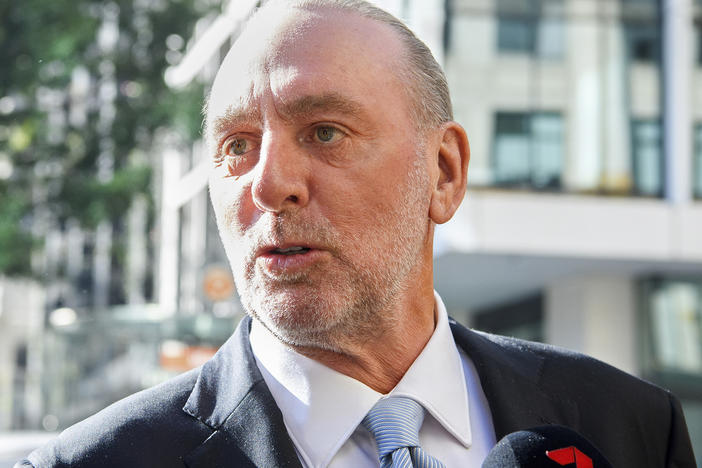 Hillsong church founder Brian Houston arrives Thursday at the Downing Centre Local Court in Sydney. He was ruled not guilty of a charge of concealing his father's child sex crimes.