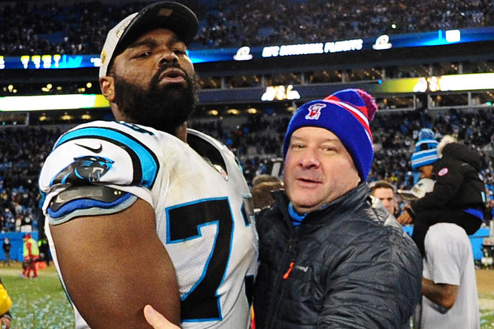 Michael Oher of the Carolina Panthers celebrates with his family after the NFC Championship Game against the Arizona Cardinals at Bank Of America Stadium on January 24, 2016 in Charlotte, N.C.