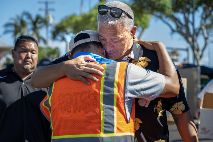 Maui County Mayor Richard Bissen Jr. visits a distribution center at Lahaina Crossing. A deadly wildfire destroyed the city of Lahaina, Maui.