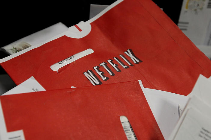 Red Netflix envelopes sit in a bin of mail at the U.S. Post Office sort center March 30, 2010 in San Francisco, California. The company is ending its DVD mailing service with a promotion.