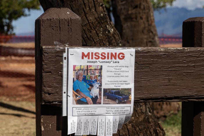 A sign at Honokawai Beach Park seeks information about a person unaccounted for after a wildfire ravaged parts of Maui. Officials are still working to determine the fate of 850 people.