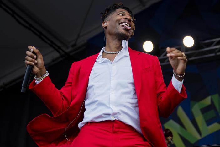 Jon Batiste performs at the Newport Folk festival on August 5, 2023. Batiste, a riveting live performer who has led the band at <em>The Late Show</em> and won an album of the year Grammy, just released a studio album, <em>World Music Radio</em>, that feels like an attempt to consolidate his billowing talent into a stable unit, like squeezing a genie back into the bottle.