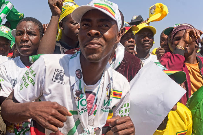 Darius Bongwe, 28, dances at President Emmerson Mnangagwa's final rally at Tongogara Business Center on Saturday ahead of Zimbabwe's general elections on Wednesday. Bongwe believes President Mnangagwa and the ruling ZANU-PF party can revive the country's economy.