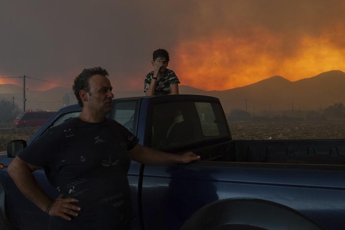 Residents watch the wildfire in Avantas village, near Alexandroupolis, in the northeastern Evros region of Greece on Monday.