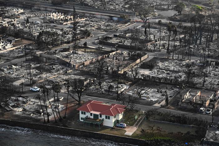 The fire that devastated historic Lahaina in western Maui left a red-roofed house relatively unscathed. Its owner says he wants to open the house to the neighborhood to help the rebuilding process.